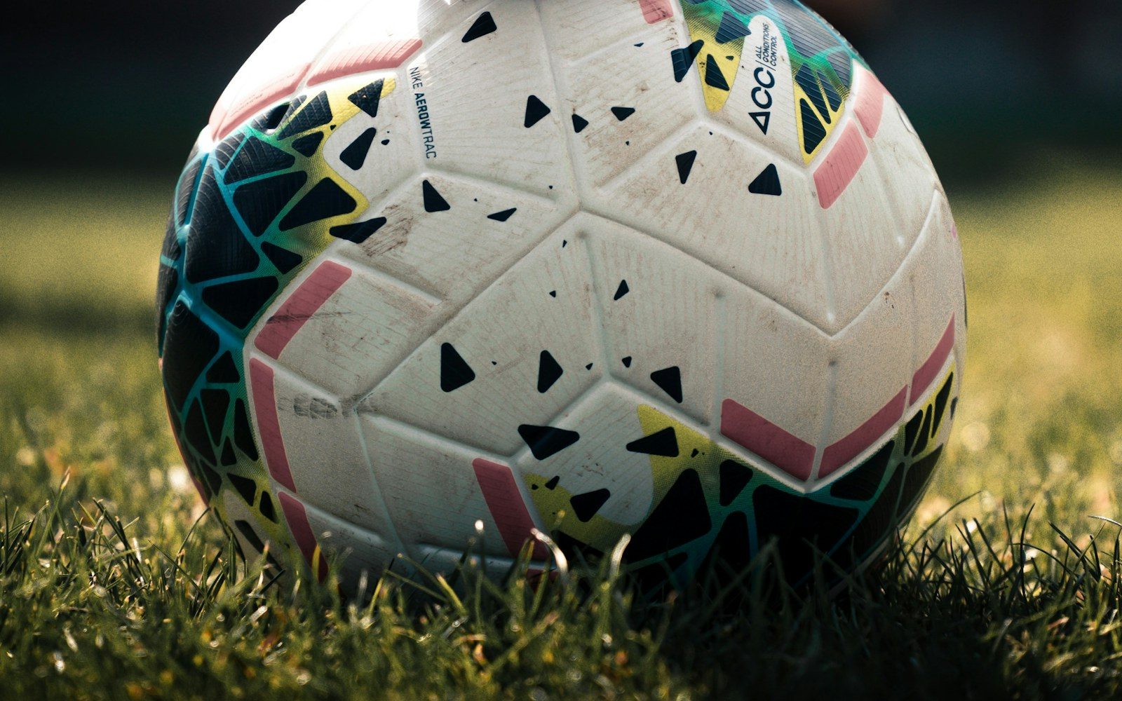 Close view of a soccer ball on grass during a match